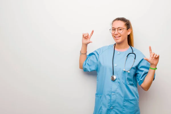 Young Latin Nurse Framing Outlining Own Smile Both Hands Looking — 스톡 사진