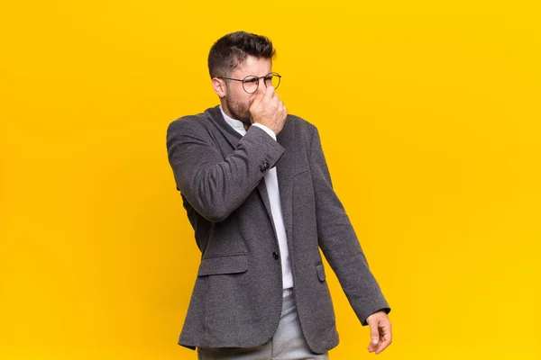 Young Handosme Man Feeling Disgusted Holding Nose Avoid Smelling Foul — ストック写真