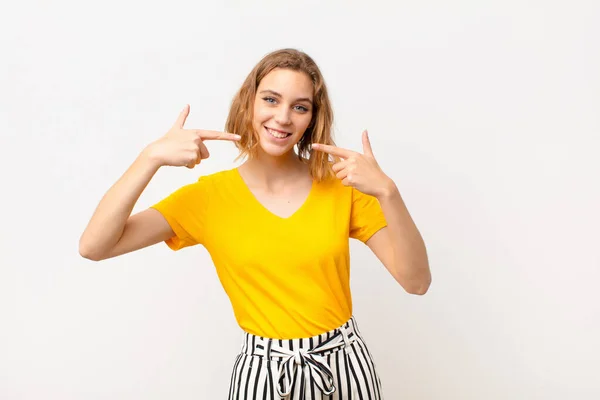 Young Blonde Woman Smiling Confidently Pointing Own Broad Smile Positive — Stock Photo, Image