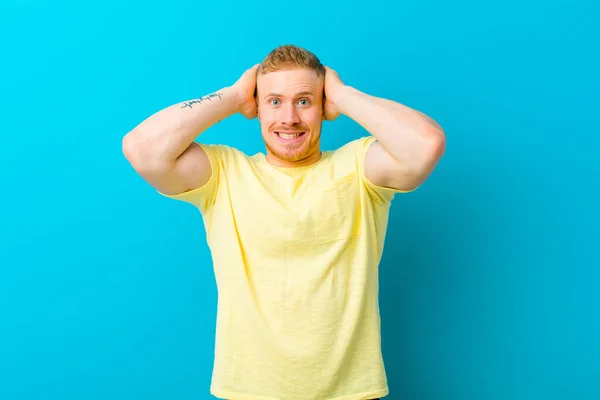 Jonge Blonde Man Draagt Geel Shirt Gevoel Van Stress Bezorgd — Stockfoto