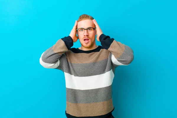 Young Blonde Man Looking Unpleasantly Shocked Scared Worried Mouth Wide — Stockfoto