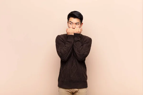 Young Chinese Man Looking Worried Anxious Stressed Afraid Biting Fingernails — Stock Photo, Image