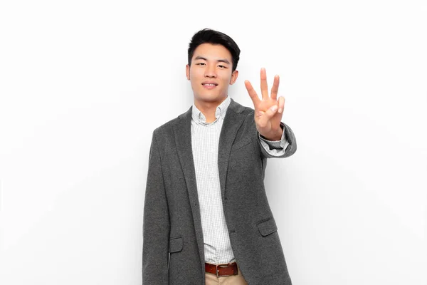 Jovem Chinês Homem Sorrindo Olhando Amigável Mostrando Número Três Terceiro — Fotografia de Stock