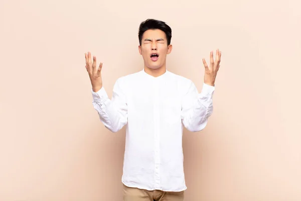 Young Chinese Man Furiously Screaming Feeling Stressed Annoyed Hands Air — Stock Photo, Image