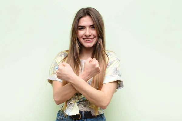 Young Pretty Woman Smiling Cheerfully Celebrating Fists Clenched Arms Crossed — Stock Photo, Image