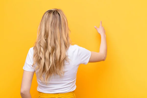 Young Pretty Blonde Woman Standing Pointing Object Copy Space Rear — Stock Photo, Image