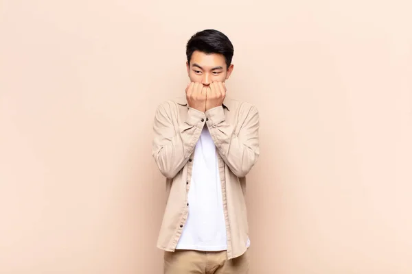 Young Chinese Man Looking Worried Anxious Stressed Afraid Biting Fingernails — Stock Photo, Image