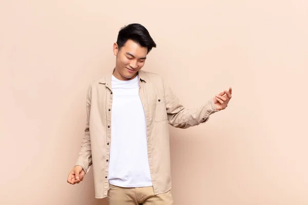 Young Chinese Man Smiling Feeling Carefree Relaxed Happy Dancing Listening — Stock Photo, Image