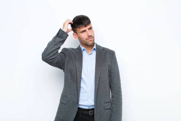 Young Handsome Man Feeling Puzzled Confused Scratching Head Looking Side — Stock Photo, Image