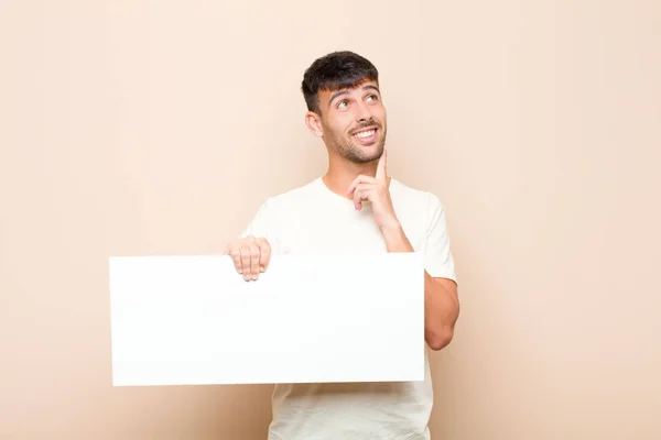 Young Handsome Man Smiling Happily Daydreaming Doubting Looking Side Placard — Stock Photo, Image