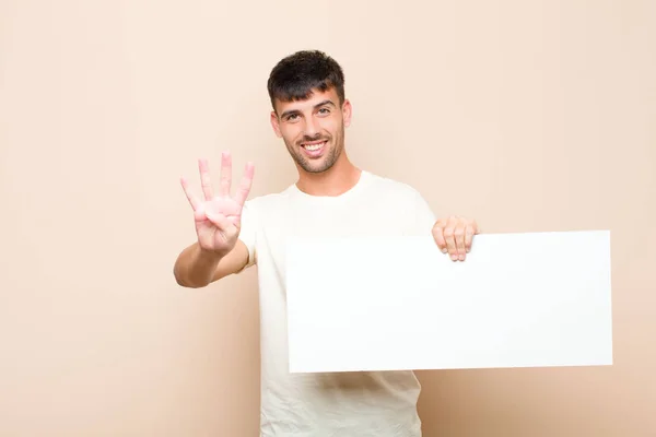 Junger Gutaussehender Mann Lächelt Und Sieht Freundlich Aus Zeigt Nummer — Stockfoto