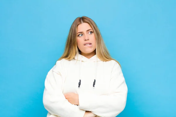 Young Blonde Woman Doubting Thinking Biting Lip Feeling Insecure Nervous — Stock Photo, Image