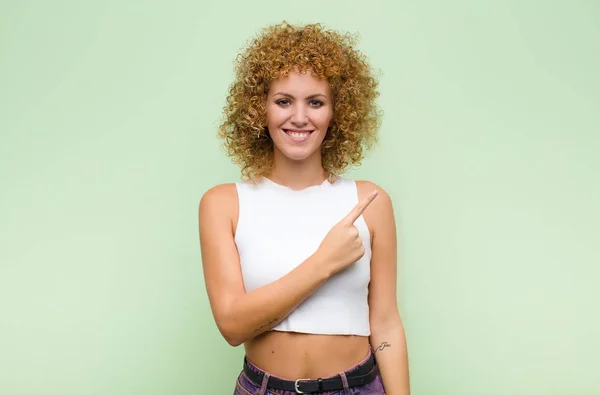 Young Afro Woman Smiling Cheerfully Feeling Happy Pointing Side Upwards — Stock Photo, Image