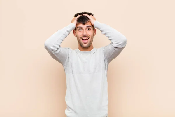 Young Handsome Man Raising Hands Head Open Mouthed Feeling Extremely — Stockfoto