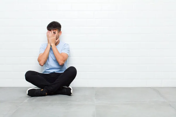 Young Handsome Man Feeling Scared Embarrassed Peeking Spying Eyes Half — Stockfoto