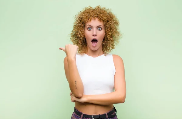 Young Afro Woman Looking Astonished Disbelief Pointing Object Side Saying — Stock Photo, Image