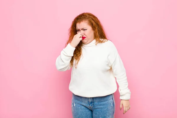 Young Red Head Woman Feeling Disgusted Holding Nose Avoid Smelling — 스톡 사진