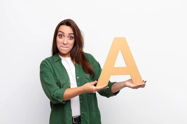 Young Pretty Woman Confused Doubtful Thinking Holding Letter Alphabet Form — Stock Photo, Image