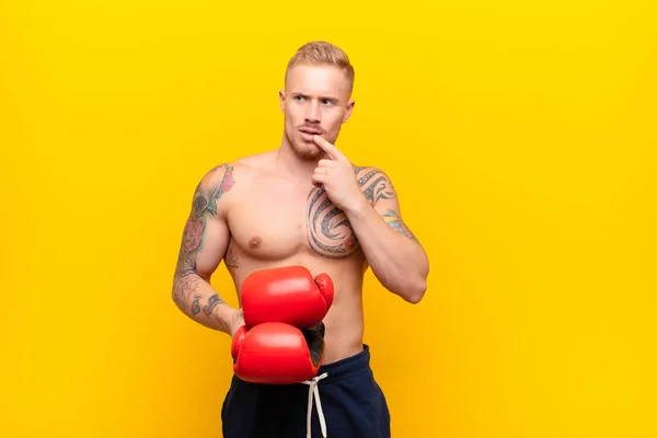 Young Blonde Strong Man Surprised Nervous Worried Frightened Look Looking — Stock Photo, Image