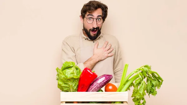 Green Grocery Man Feeling Shocked Surprised Smiling Taking Hand Heart — Stock Photo, Image