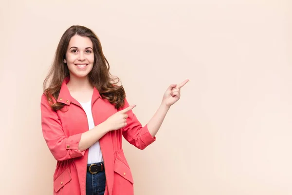 Young Pretty Woman Smiling Happily Pointing Side Upwards Both Hands — Stock Photo, Image