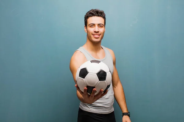 Young arabian man with a soccer ball. sport concept — Stock Photo, Image