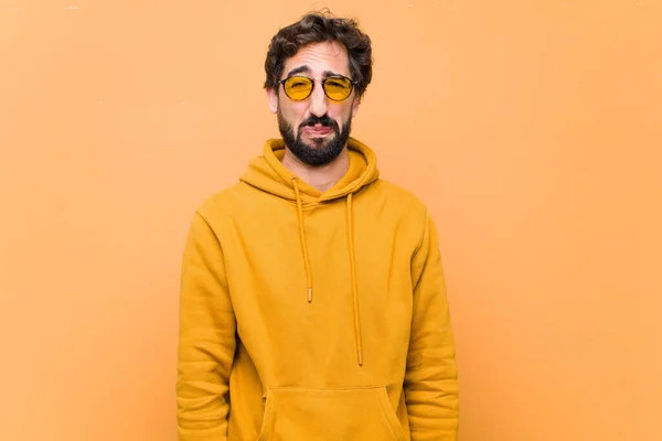 Joven Loco Fresco Hombre Triste Expresión Contra Pared Naranja —  Fotos de Stock