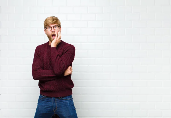 Young Blonde Man Open Mouthed Shock Disbelief Hand Cheek Arm — 스톡 사진