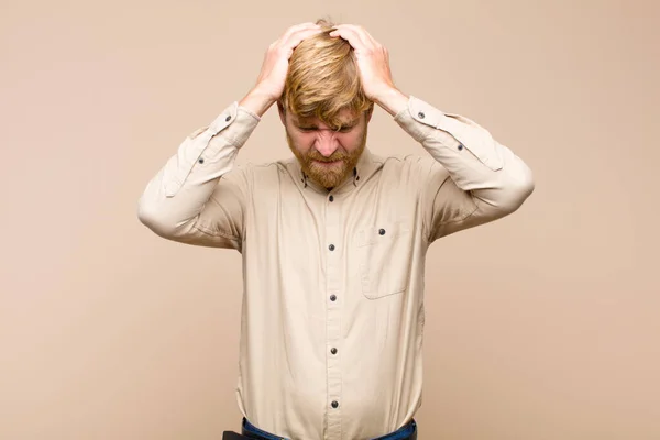Young Blonde Man Feeling Stressed Frustrated Raising Hands Head Feeling — Stock Photo, Image