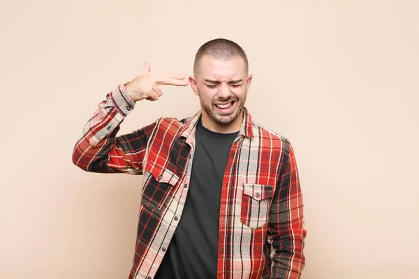 Young Handsome Man Looking Unhappy Stressed Suicide Gesture Making Gun — Stock Photo, Image