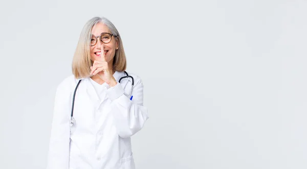 Middle Age Doctor Woman Looking Serious Cross Finger Pressed Lips — Stock Photo, Image