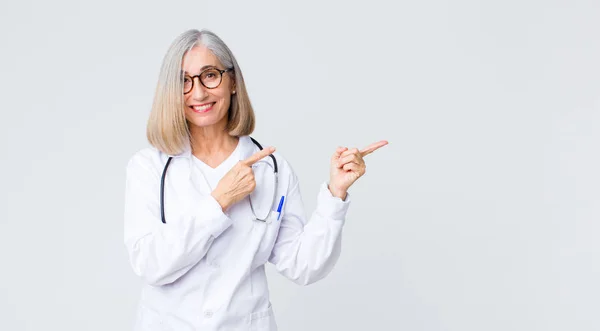 Middle Age Doctor Woman Smiling Happily Pointing Side Upwards Both — Stock Photo, Image