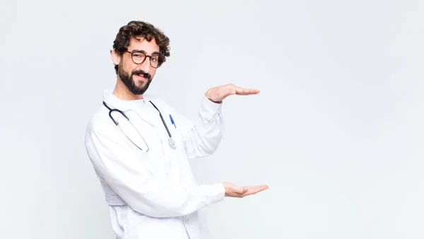 Young Doctor Man Holding Object Both Hands Side Copy Space — Stock Photo, Image