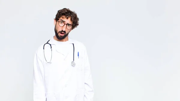 Young Doctor Man Feeling Puzzled Confused Dumb Stunned Expression Looking — Stockfoto