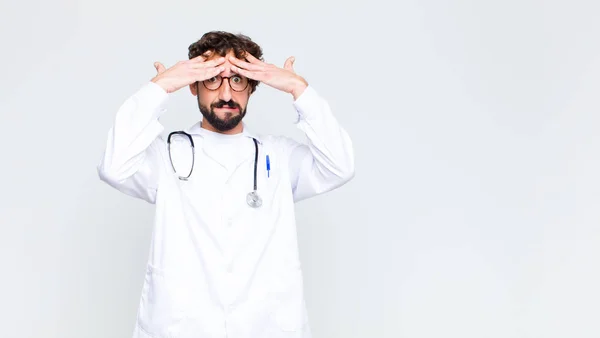 Young Doctor Man Raising Hands Head Open Mouthed Feeling Extremely — Stock Photo, Image