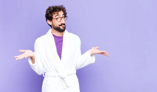Young Bearded Man Wearing Bathrobe Feeling Puzzled Confused Doubting Weighting — Stock Photo, Image