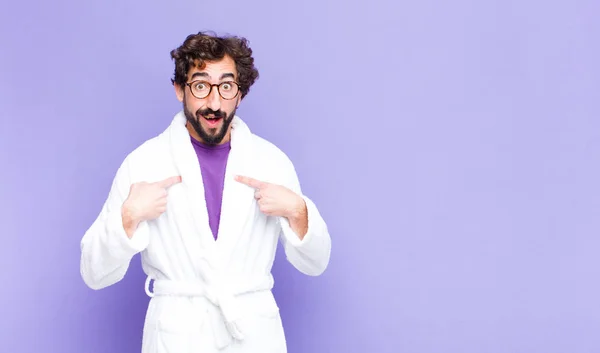 Young Bearded Man Wearing Bathrobe Feeling Happy Surprised Proud Pointing — Stock Photo, Image
