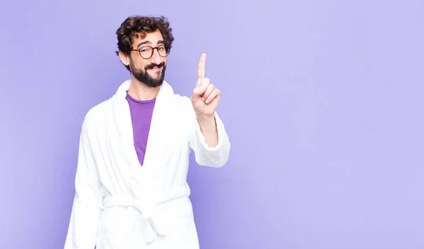 Young Bearded Man Wearing Bathrobe Smiling Looking Friendly Showing Number — Stock Photo, Image