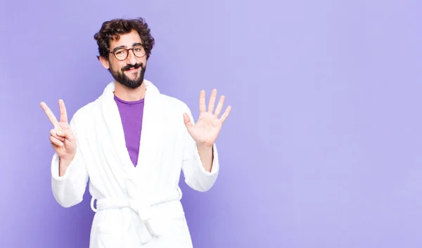 Young Bearded Man Wearing Bathrobe Smiling Looking Friendly Showing Number — Stock Photo, Image