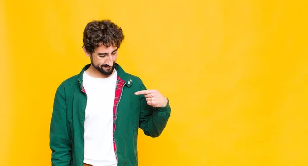 Young Crazy Bearded Man Smiling Cheerfully Casually Looking Downwards Pointing — Stock Photo, Image