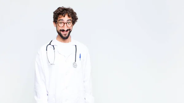 Jovem Médico Homem Olhando Feliz Pateta Com Largo Divertido Louco — Fotografia de Stock