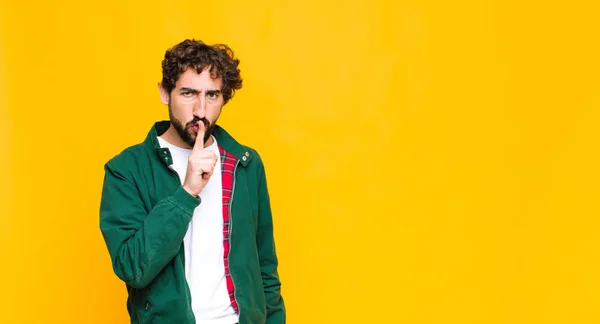 Young Crazy Bearded Man Looking Serious Cross Finger Pressed Lips Royalty Free Stock Photos