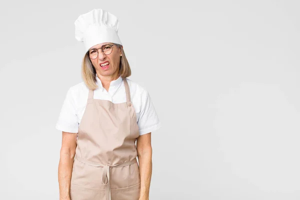 Middle Age Baker Woman Feeling Puzzled Confused Dumb Stunned Expression — ストック写真