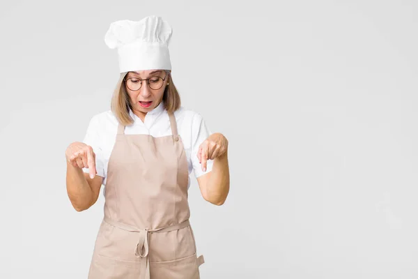 Middle Age Baker Woman Feeling Shocked Open Mouthed Amazed Looking — Stock Photo, Image