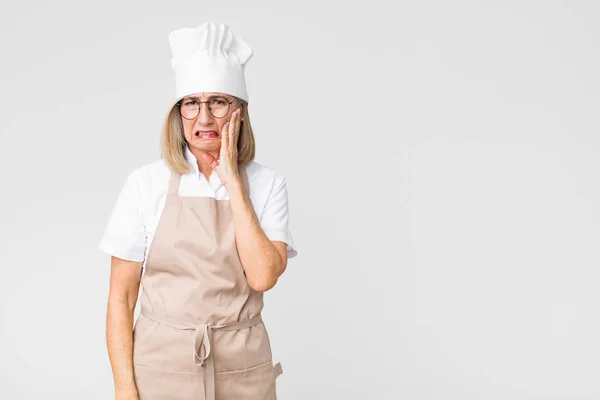 Middle Age Baker Woman Holding Cheek Suffering Painful Toothache Feeling — Stock Photo, Image