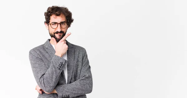 Young Crazy Businessman Looking Serious Thoughtful Distrustful One Arm Crossed Royalty Free Stock Images