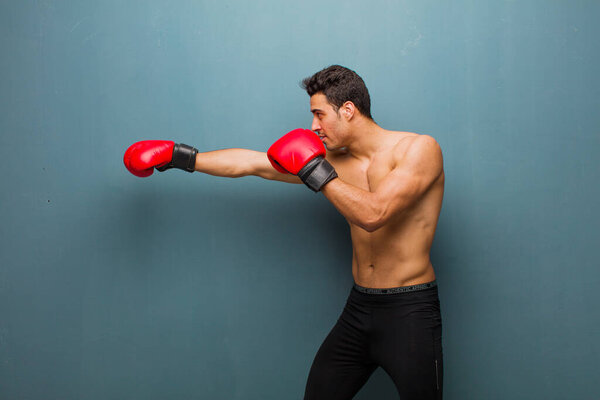young arabian man with boxing gloves. sport concept