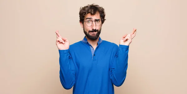 Young Handsome Man Crossing Fingers Anxiously Hoping Good Luck Worried — Stock Photo, Image