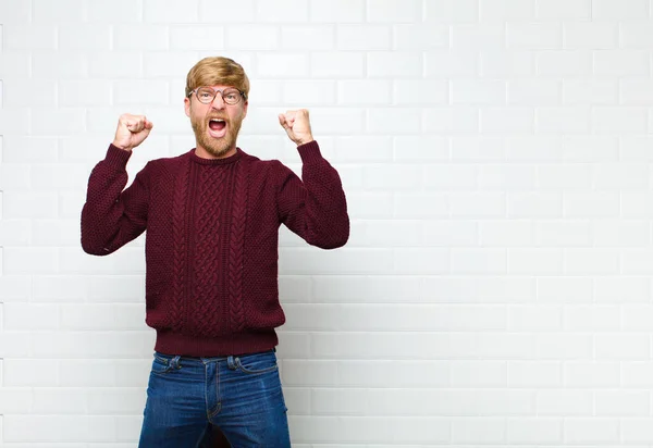 Young Blonde Man Shouting Aggressively Angry Expression Fists Clenched Celebrating — ストック写真