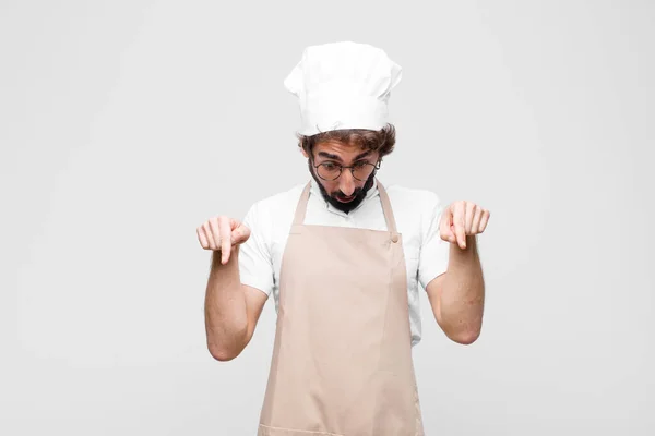 Young Crazy Chef Feeling Shocked Open Mouthed Amazed Looking Pointing — Stock Photo, Image